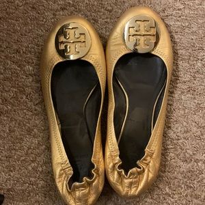 Tory Burch Reva flats. They are worn, tip on one is scuffed— refer to photos.